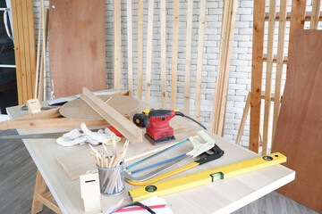 Carpentry tools on a workbench inside a carpentry shop carpentry concept.