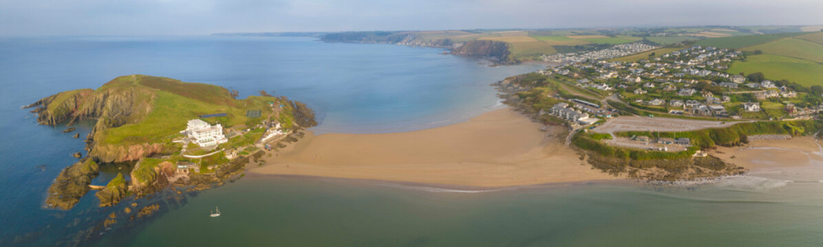 Aerial view of Burgh Island Hotel and Bigbury Beach tombolo in the South Hams, Devon, England