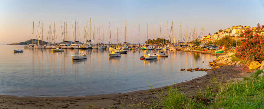 View of boats overlooking Skiathos Town at sunrise, Skiathos Island, Sporades Islands, Greek Islands, Greece