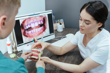Young boy at the dentist learning dental hygiene
