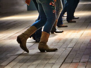 Legs close up of traditional western folk music dancers blur dynamism effect