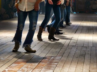 Legs close up of traditional western folk music dancers blur dynamism effect