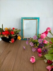 Fototapeta na wymiar frame with roses on the table 
