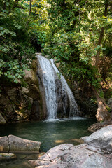Fototapeta na wymiar Beautiful waterfall Kefalogourna in Theologos, Thassos, Greece