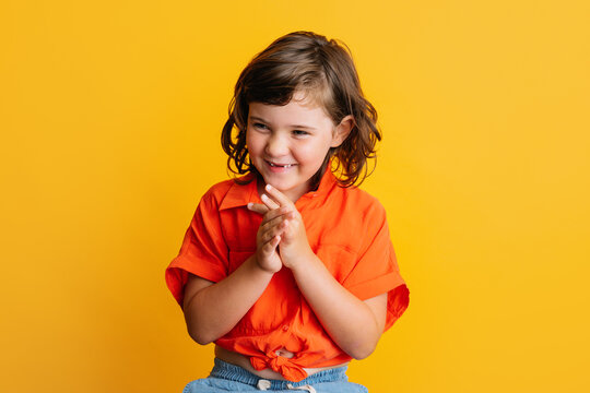 Cheerful Girl Smiling Rubbing Hands