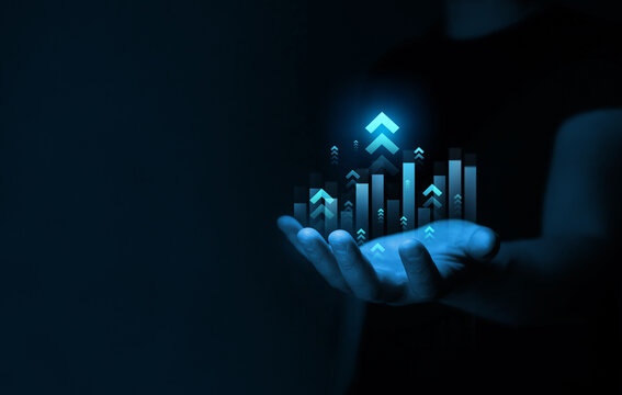 Businessman drawings growth graph of business. Successful business, growth strategy and achieving goals with the rising arrow.  Business strategy development and growing growth plan. 