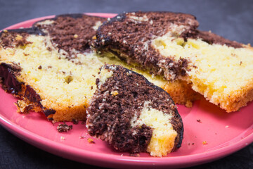Fresh baked yeast dough with cocoa and chocolate icing. Delicious dessert