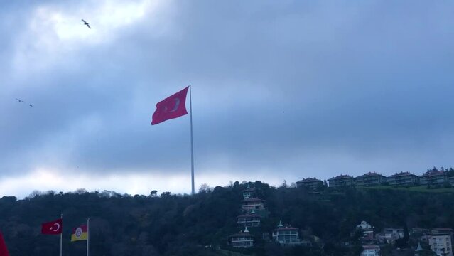 Big turkey falg in rainy weather. Large turkey flag on a flagpole in rainy weather