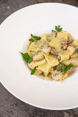 Fettuccine chicken with mushrooms in cream sauce