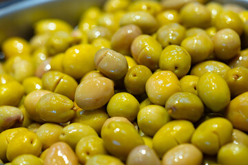 Appetizing marinated olives in a shop stall display