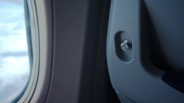 Airplane flight. The Salon of a Passenger Plane the Flight. Wings of an airplane flying above the clouds. View from the window of the planet. Aircraft. Traveling by air. 4K video
