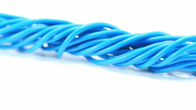 Blue wire cable of usb and adapter isolated on white background.Electronic Connector.Slow motion footage moving from right to left.Macro vdo.Selection focus.