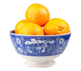 Oranges in an ancient hand-painted bowl