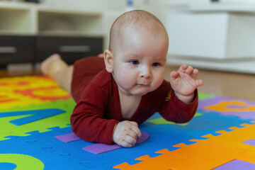 Cute baby crawling on the floor. first time