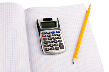 Calculator with pencil on squared paper isolated over white