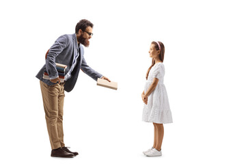 Full length profile shot of a male teacher giving a book to a girl