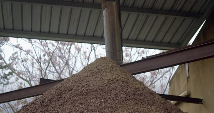 Discharging olive pomace in the olive mill of Sicily, Italy