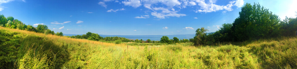 Fototapeta na wymiar Beautiful landscape of Kaniv Reservoir shore, Ukraine, in sunny day with bright blue sky