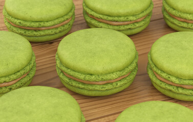 Set of green macaroons on a wooden background, 3d render