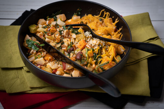 A Bowl Of Warm Salad  Containing Mixed Root Vegetables, Beans, Kale And Chipotle Corn Salsa