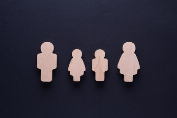 Family concept. Wooden figures of family members.