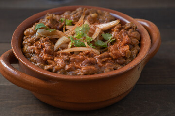 Vegan refried beans in clay pot 