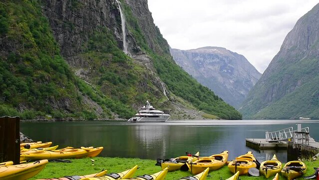 Tourist boat sailing in beautiful fjord landscape, Norway