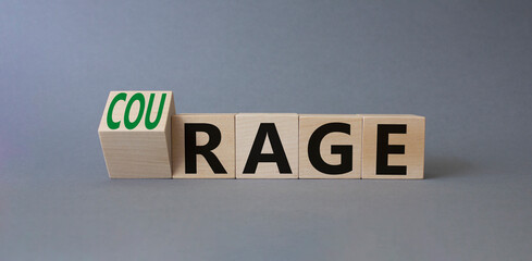 Courage and rage symbol. Turned wooden cubes with words Rage and Courage. Beautiful grey background. Business concept. Copy space.