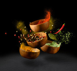 Spices and seasonings powder splash, explosion on black background
