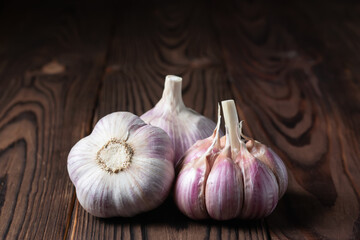 Garlic bulb on wooden background. Close up