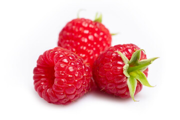 Closeup of red raspberry berries on white background