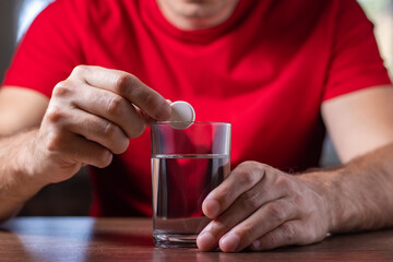 Man With Hangover Taking Medicine Pill Cure