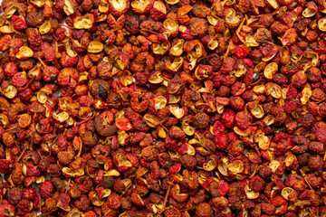 Sichuan hoju pepper. Pepper close-up as a background. Spices of China, Tibet, Japanese pepper Huajiao. Seasoning for dishes. Additive for the preparation of delicious delicacies. Sauces set.
