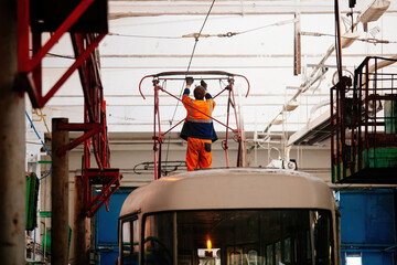 Tram in service depot. Maintenance and repairing of pantograph