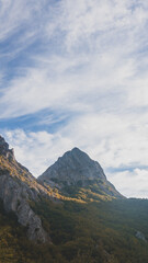 Obraz premium Sky with clouds at sunset and with a beautiful mountain peak 