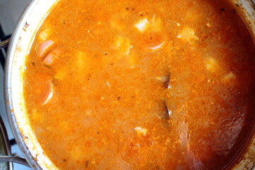 solyanka soup in a saucepan top view