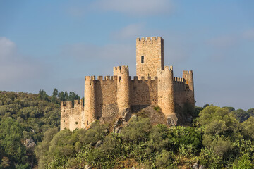 Fototapeta na wymiar View at the Castle of Almourol is a medieval castle atop the islet of Almourol in the middle of the Tagus River