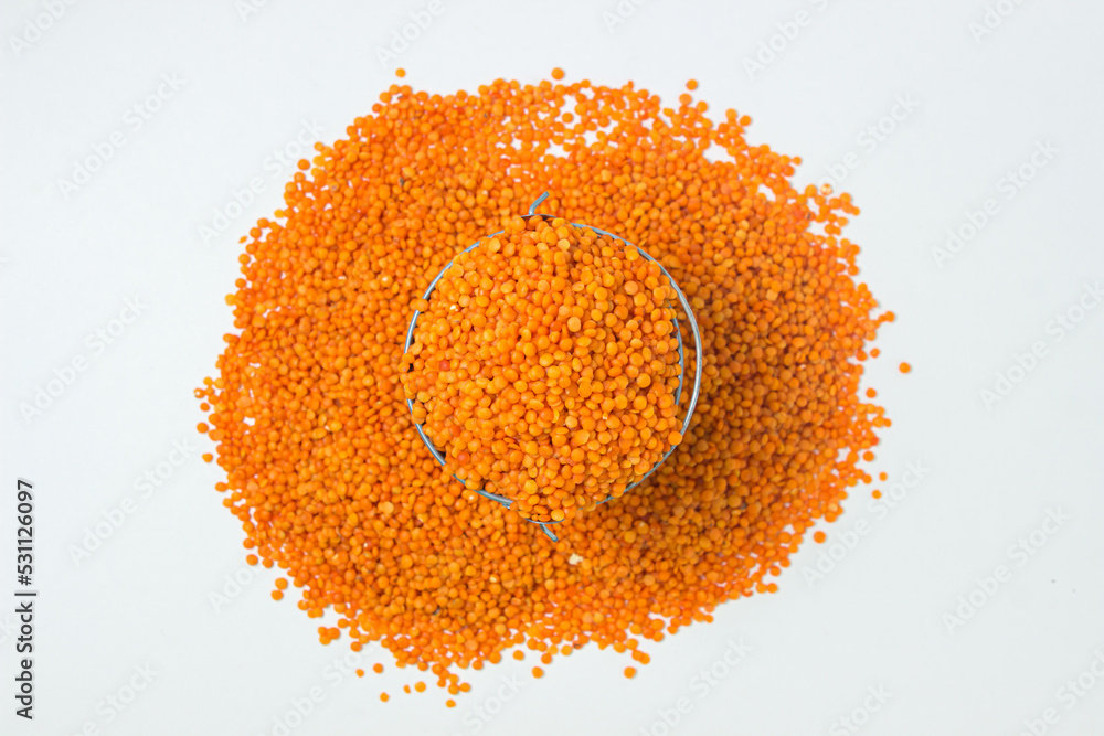 Canvas Prints Red lentils in a small bucket on a white background. Delicious vegetarian food