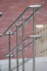 aluminum metal stair railings parallel to the distance