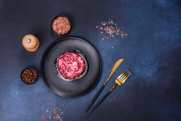 Traditional Ukrainian multilayered salad from herring, beets, potatoes, carrots and eggs