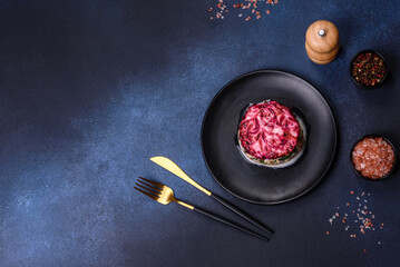 Traditional Ukrainian multilayered salad from herring, beets, potatoes, carrots and eggs