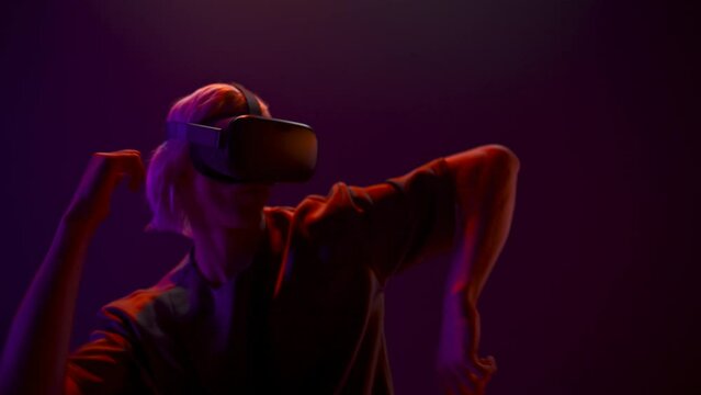 Active man dancing moving metaverse game closeup. Gamer playing 3D simulation