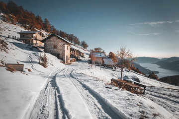 rustic village in the snow in the mountains