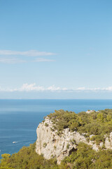 Scenic view of sea and mountains against sky