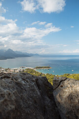 Scenic view of sea and mountains against sky