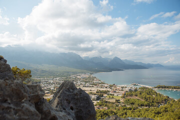 Scenic view of sea and mountains against sky