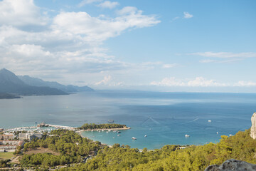 Scenic view of sea and mountains against sky