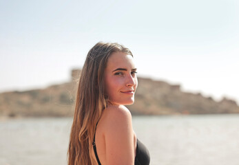 Fototapeta na wymiar portrait of a young woman on a beach