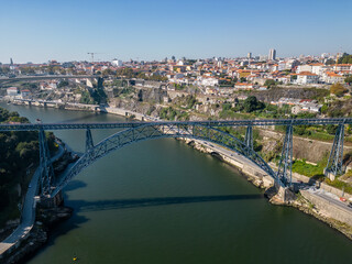 Fototapeta premium Aerial view of Porto, Douro River with boats and the bridges