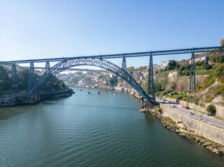Fototapeta na wymiar Aerial view of Porto, Douro River with boats and the bridges
